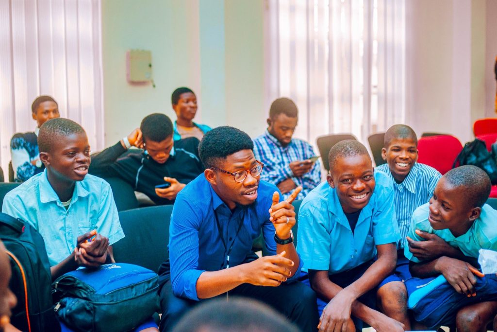 Boys Without Borders volunteer engaging secondary school boys during break out session at Ibadan Boys Conference 2026