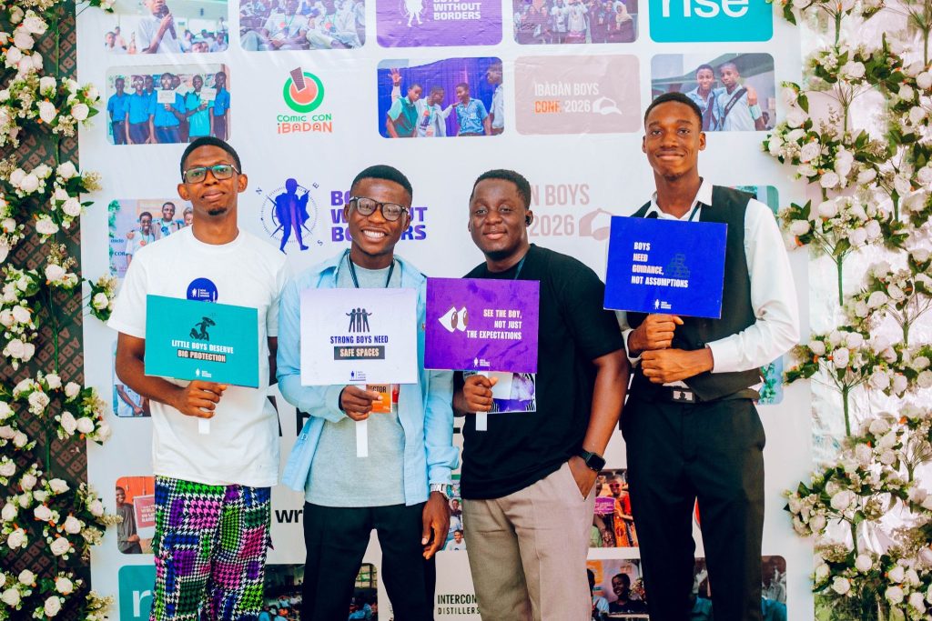 Boys Without Borders NG volunteers holding up placards that read, "Little Boys Deserve Big Protection", "Strong Boys Need Safe Spaces", "See The Boy, Not Just The Expectations", "Boys Need Guidance, Not Assumptions".